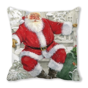 Detail of Christmas pillow cover with vintage Santa Claus print on soft peach skin fabric
