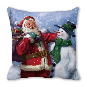 Detail view of peach skin fabric cushion featuring Santa Claus and snowman festive print
