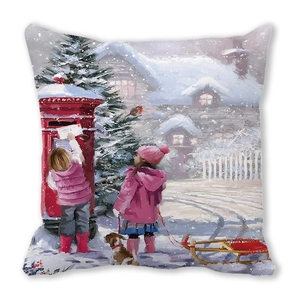 Detail of square cushion cover featuring winter scenery illustration and snowy house