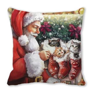 Detail of Christmas pillow cover featuring Santa and cute kittens in a red stocking