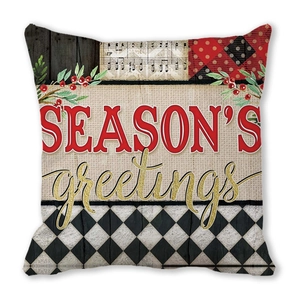 Kissenbezug zu Weihnachten mit Season's Greetings Text und Vintage-Patchwork-Muster
