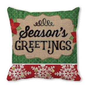 Detailansicht des Weihnachtskissenbezugs mit Season's Greetings und Schneeflocken