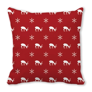 Close-up of red bohemian Christmas elk pattern on soft peach skin pillowcase fabric
