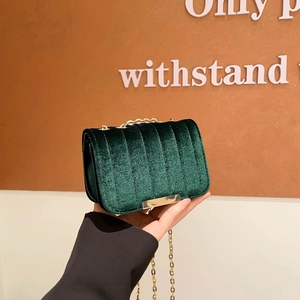 Fashionable emerald green velvet quilted mini crossbody bag with gold chain strap