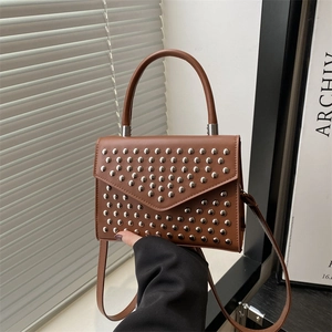 Brown leather crossbody bag with silver stud rivets and fixed top handle for women