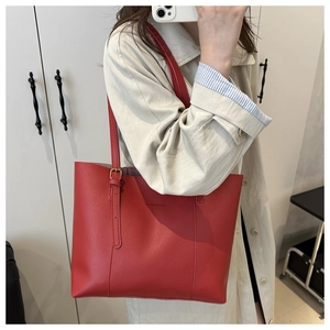 Mirror selfie showing a large red tote bag with Fashion & Bags text on shoulder