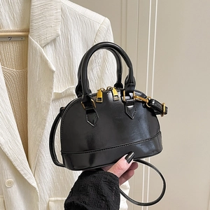 Glossy black crocodile pattern shell bag with gold hardware and removable shoulder strap