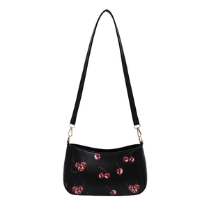 Chic black shoulder bag with cherry print and golden hardware for women on white background