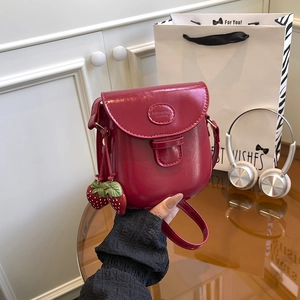 Retro deep red patent leather crossbody bag with cute strawberry charms and embossed logo