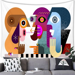 Detail of abstract face wall tapestry in colorful geometric style over grey sofa