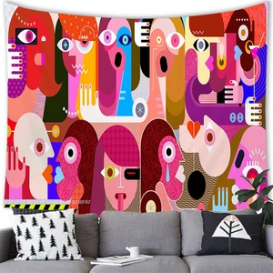 Detail of pop art tapestry with abstract faces and Keep Out stripe design over a sofa