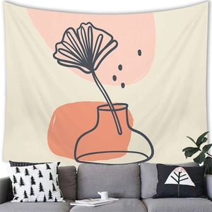 Detailed texture of abstract line art tapestry hanging over a modern grey sofa