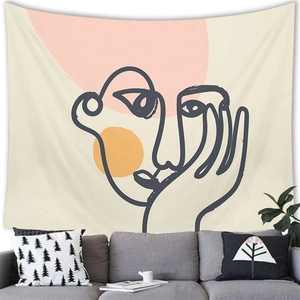 Macro view of abstract face line art on a brushed fabric tapestry for home wall decor
