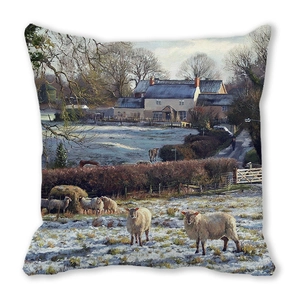 Close-up of peach skin cushion cover featuring winter village oil painting scenery