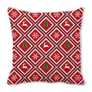 Detail of red Bohemian Christmas pillowcase with elk and snowflake geometric patterns