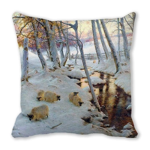 Detailed close-up of Christmas cushion featuring an oil painting style winter snow scene