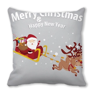 Macro detail of Christmas pillow cover featuring Santa Claus, reindeer and festive text
