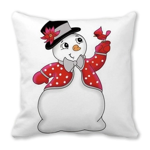 Detail of decorative Christmas pillow featuring a cartoon snowman with a red cardinal