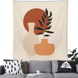 Close-up of bohemian wall tapestry with abstract pottery and plants in a cozy living room