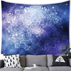 Macro detail of mandala tapestry fabric with starry galaxy pattern on living room wall