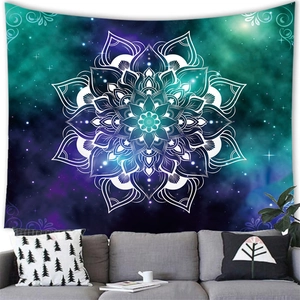 Galaxy mandala tapestry hanging above a modern sofa in a minimalist living room