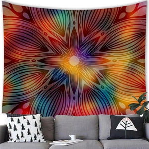 Vibrant mandala tapestry on a white wall above a sofa in a modern cozy living room