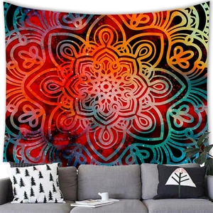 Detailed close-up of a galaxy mandala tapestry hanging above a modern living room sofa