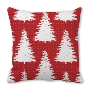 Close-up of red bohemian Christmas pillowcase with white elk and tree patterns
