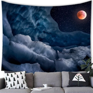 Detail view of polar glacier tapestry with red moon on a cozy living room wall