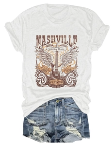 Flat lay of a white Nashville Rock Star t-shirt paired with distressed denim shorts