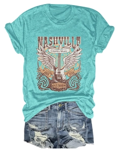 Flat lay of Nashville country music t-shirt with retro guitar print and denim shorts