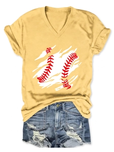 Flat lay of a yellow V-neck T-shirt with baseball graphic and ripped denim shorts