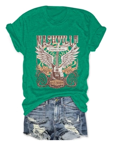 Detail of Nashville country music t-shirt with guitar graphic and denim shorts