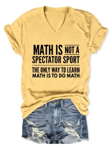 Detail of yellow V-neck T-shirt with black math slogan and rolled sleeve cuffs
