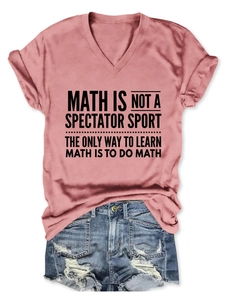 Flat lay of a dusty rose V-neck T-shirt with black math quote print and denim shorts