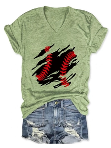 Detail of light green V-neck baseball print T-shirt and distressed denim shorts flat lay