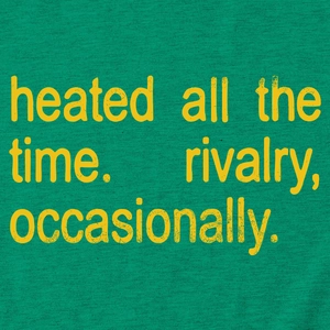 Detail of soft green knit cotton fabric with yellow 'heated all the time' printed slogan
