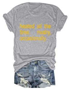 Flat lay of gray crew neck T-shirt with yellow text and distressed blue denim shorts