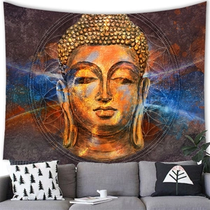 Buddha head tapestry with mandala nebula art above a sofa in a modern living room