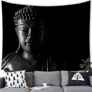 Macro detail of Zen Buddha head wall tapestry displayed over a grey fabric sofa
