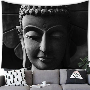 Detailed texture of black and white Buddha wall tapestry hanging in a modern living room