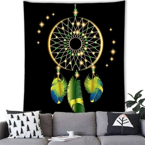 Dreamcatcher wall tapestry with colorful feathers on black background over a modern sofa