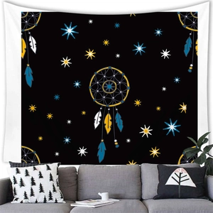 Detailed view of dreamcatcher tapestry with blue feathers hanging over a sofa in a modern room