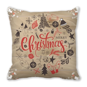 Détail de la housse de coussin de Noël avec texture bois et motifs festifs imprimés