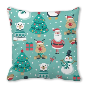 Close-up of festive Christmas cushion cover with Santa and reindeer cartoon patterns