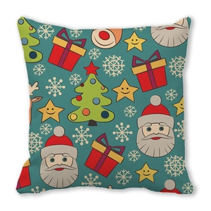 Detailed flat lay of peach skin Christmas cushion with festive Santa and tree patterns