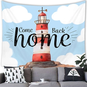 Lighthouse tapestry hanging above a grey sofa for a nautical themed home decoration