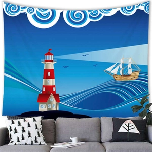 Detail of nautical tapestry featuring a lighthouse and sailboat design over a grey sofa