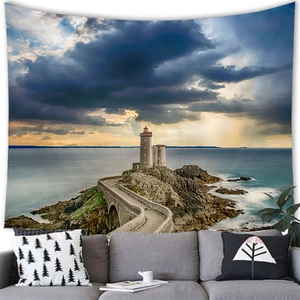 Close-up of a lighthouse wall tapestry hung over a sofa in a modern home decor setting