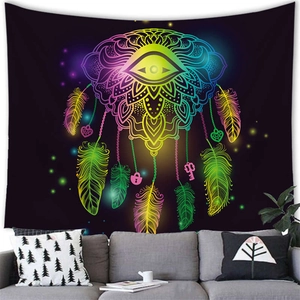 Neon dreamcatcher tapestry with feathers and all-seeing eye over a grey sofa scene